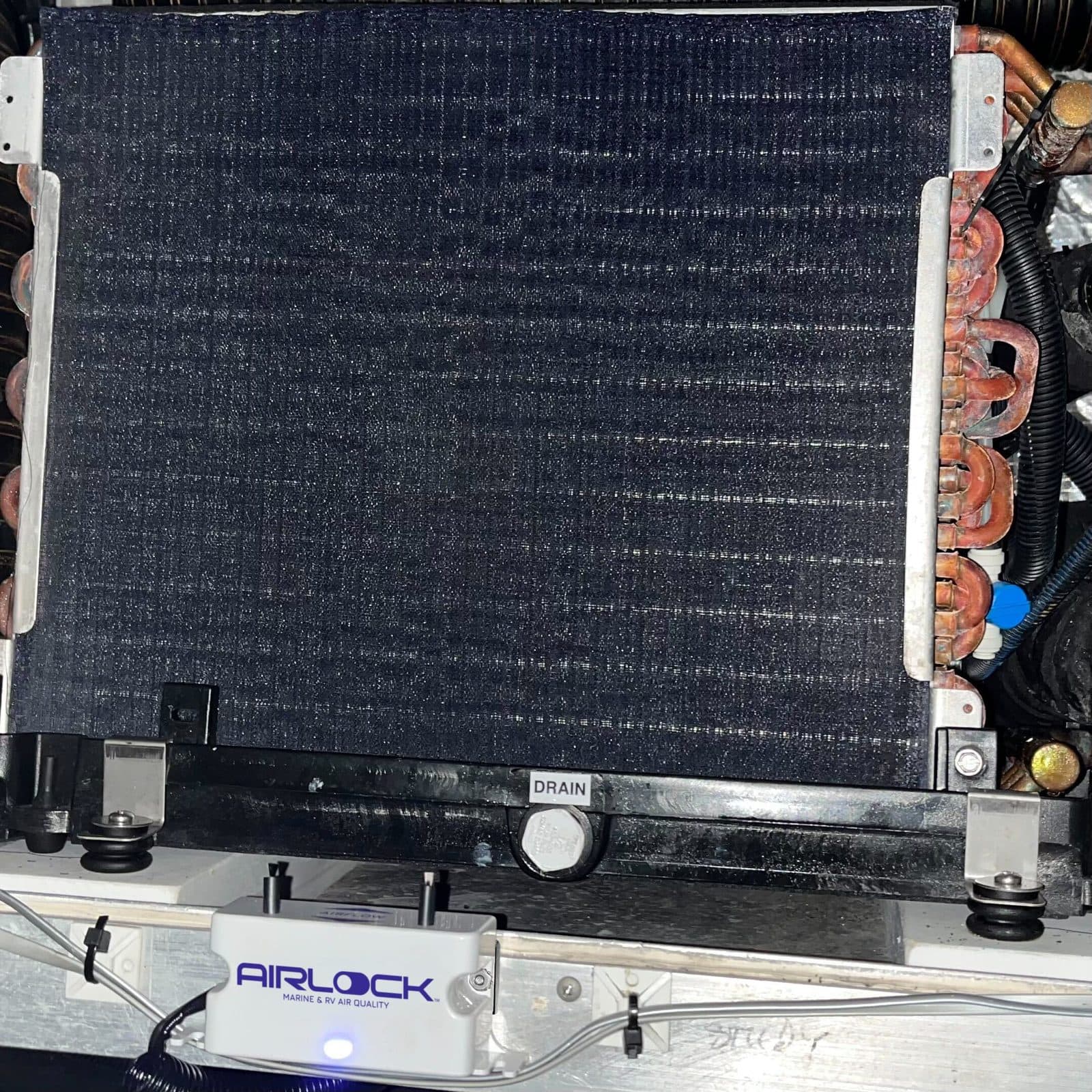 AIRLOCK One mounted on a marine AC unit