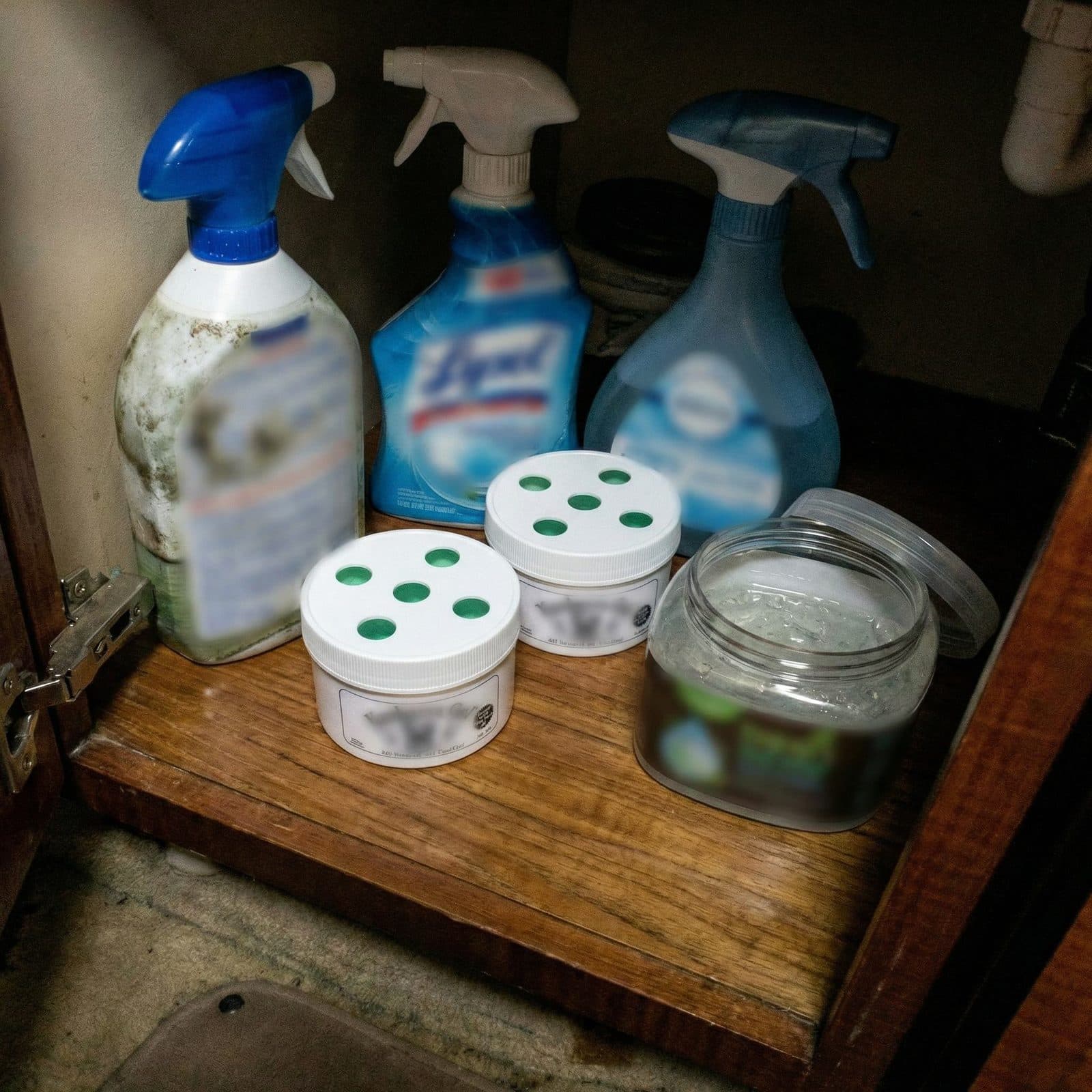 Sprays and gel air fresheners under a boat sink